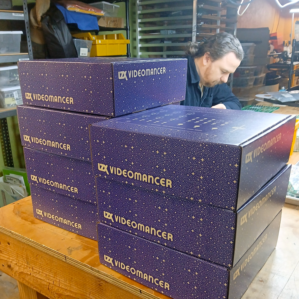 Videomancer boxes stacked in the workshop